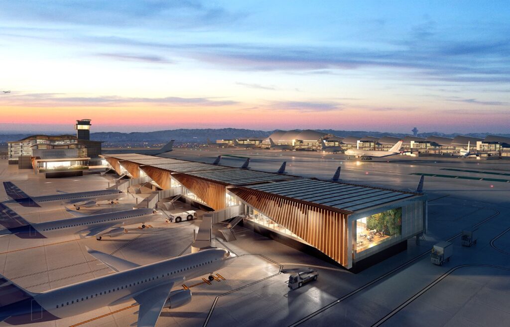 Los Angeles International Airport Midfield Satellite Concourse terminal with multiple aircraft parked at gates and modern passenger boarding bridges at sunset.